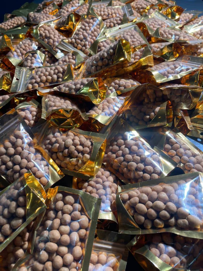 Gold snack packs filled with crunchy coated peanuts